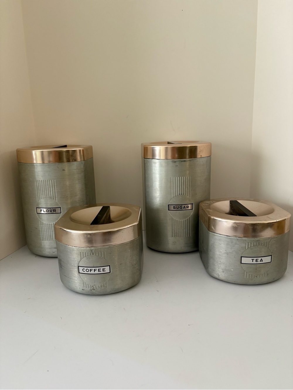 Vintage MCM brushed aluminum canister set. 2 large 2 small. Copper lids. Nice!